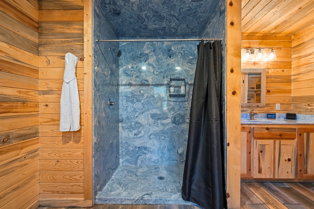 Simple and inviting, the shower offers a refreshing place to start the morning or wind down in the evening.