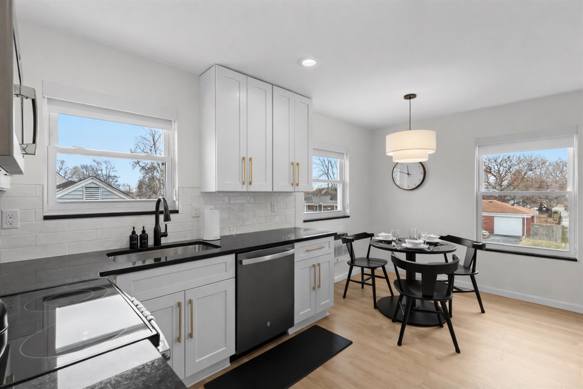 Open, sunlit kitchen and dining area with modern finishes, sleek appliances, and plenty of space to cook, gather, and enjoy meals together.