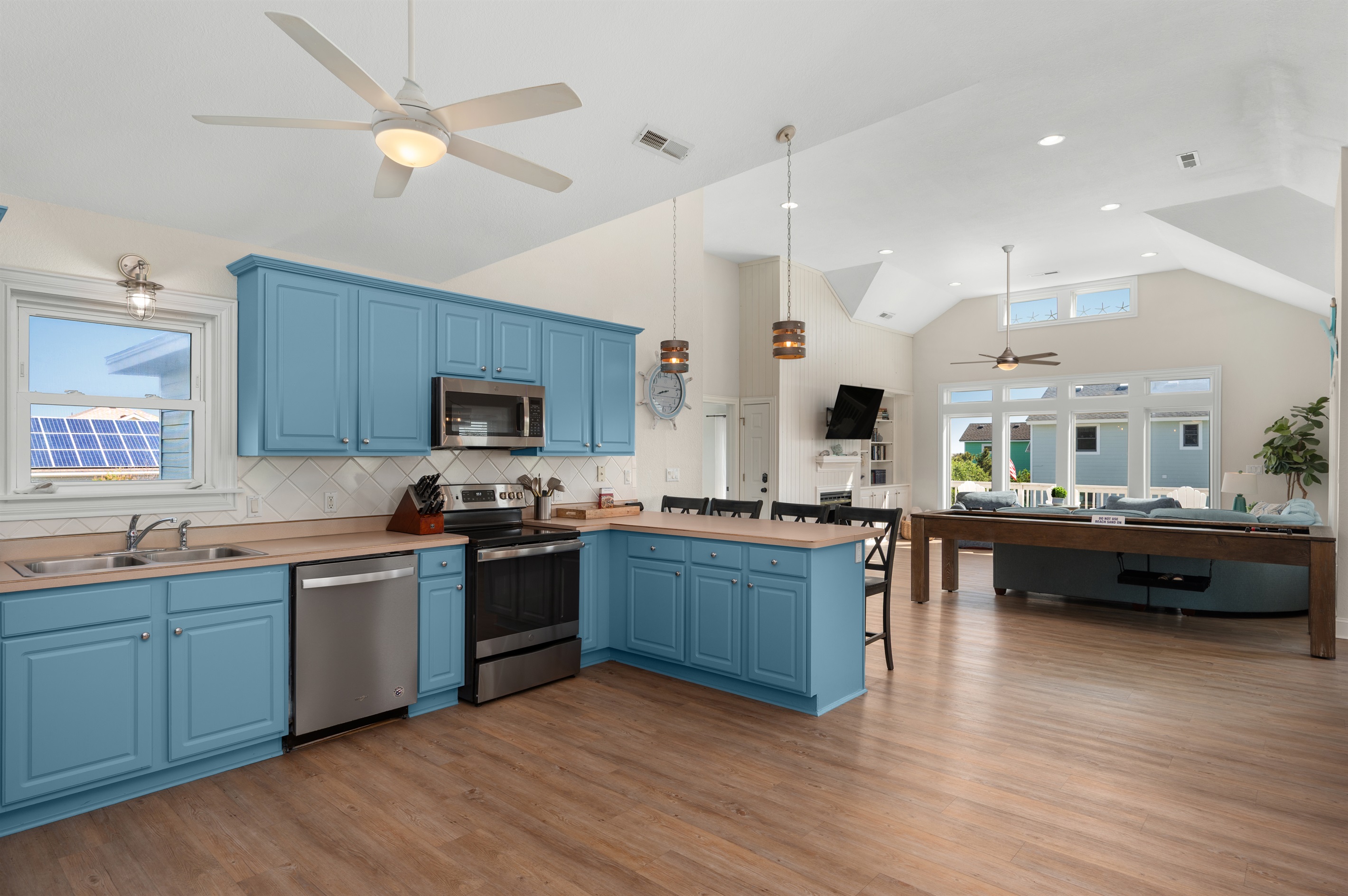 Beautifully designed kitchen flowing seamlessly into the main living area.
