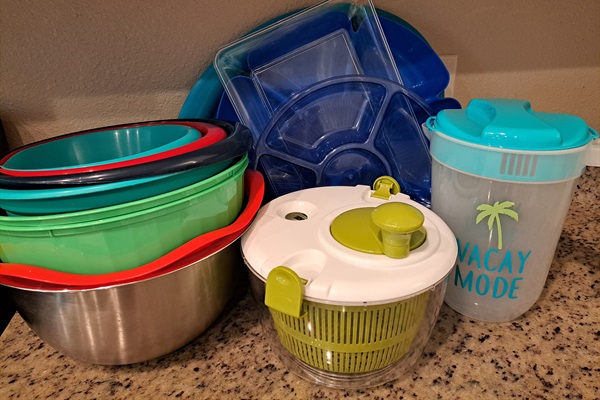 Juice jug, salad spinner, veggie platters, mixing bowls