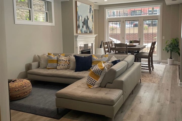 Large open living room with plenty of seating for group gatherings, movies, or relaxing after day downtown