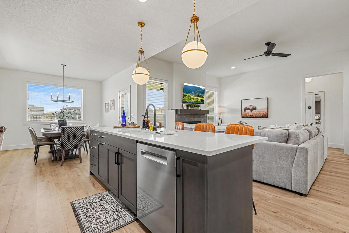 Open-concept kitchen overlooking the living room and dining area, creating the perfect space for gathering and entertaining.