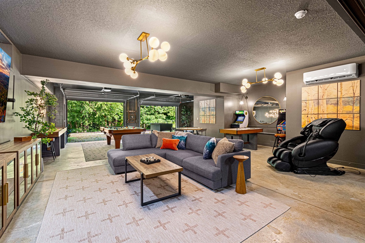 Step into the ultimate game room - challenge friends at pool or arcade classics, sink into the massage chair, or open the garage doors to let the mountain air in. Pool table, movie theatre, foosball, shuffleboard, poker, mah jongg, arcades, & 85" TV