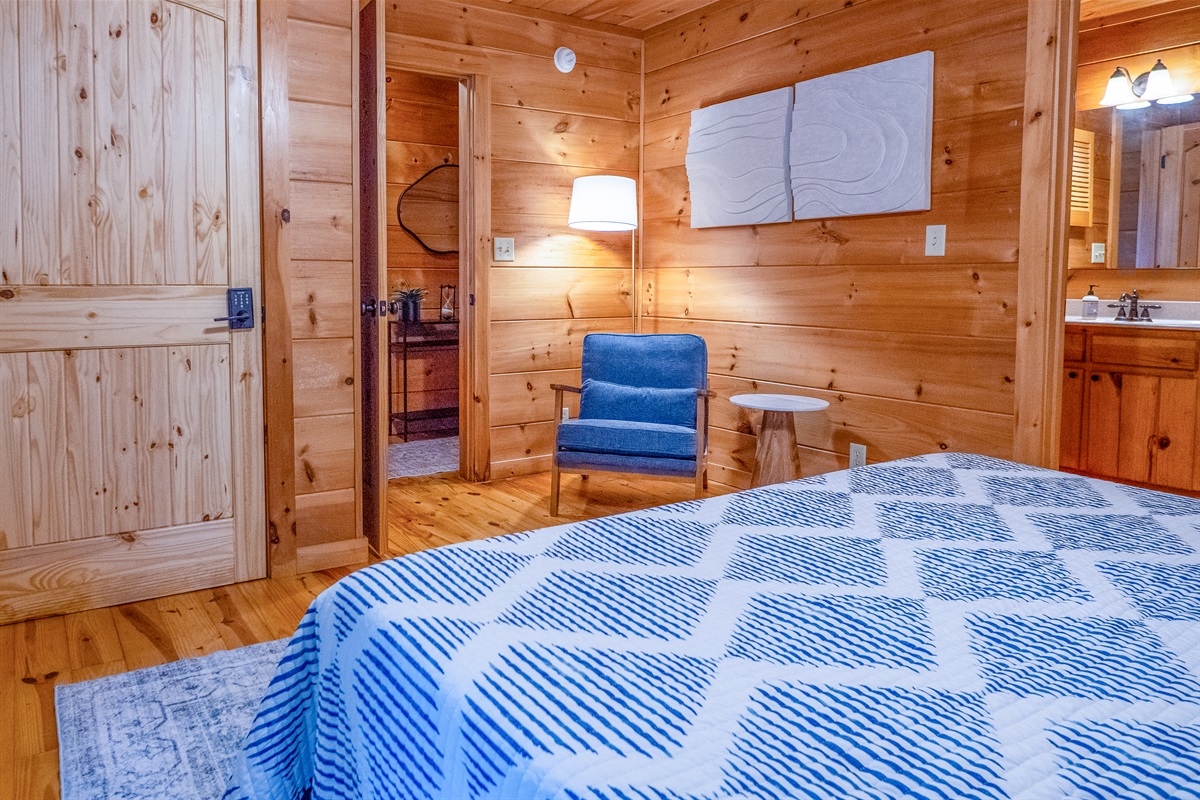 Experience true relaxation in this charming main level bedroom with an adjoining bath for added privacy.
