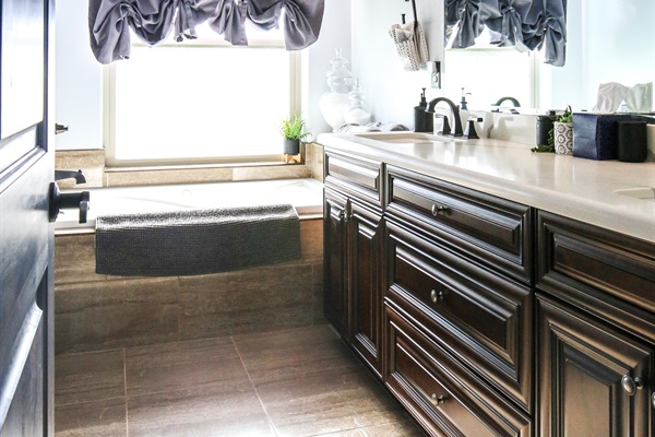 Primary master bedroom with dual vanities and jetted tub