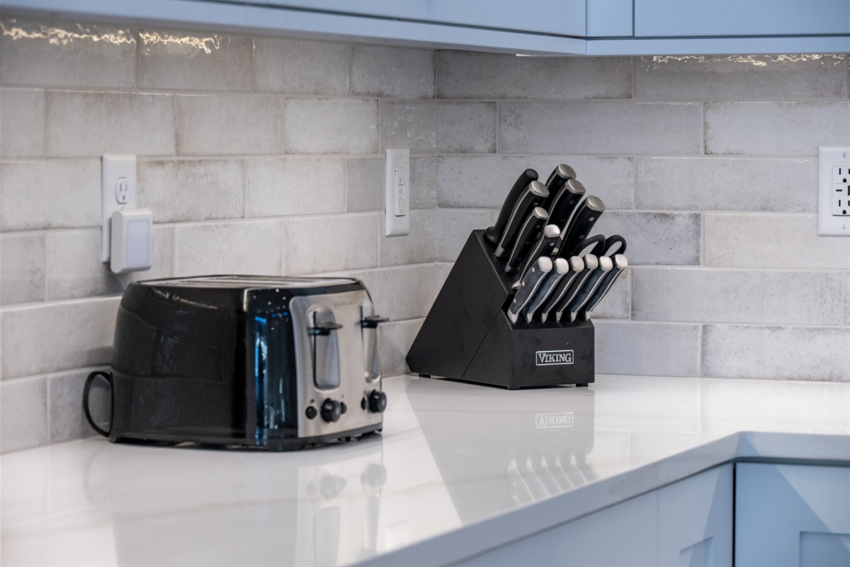 Toaster, knife set, and quality kitchen essentials provided for your convenience.