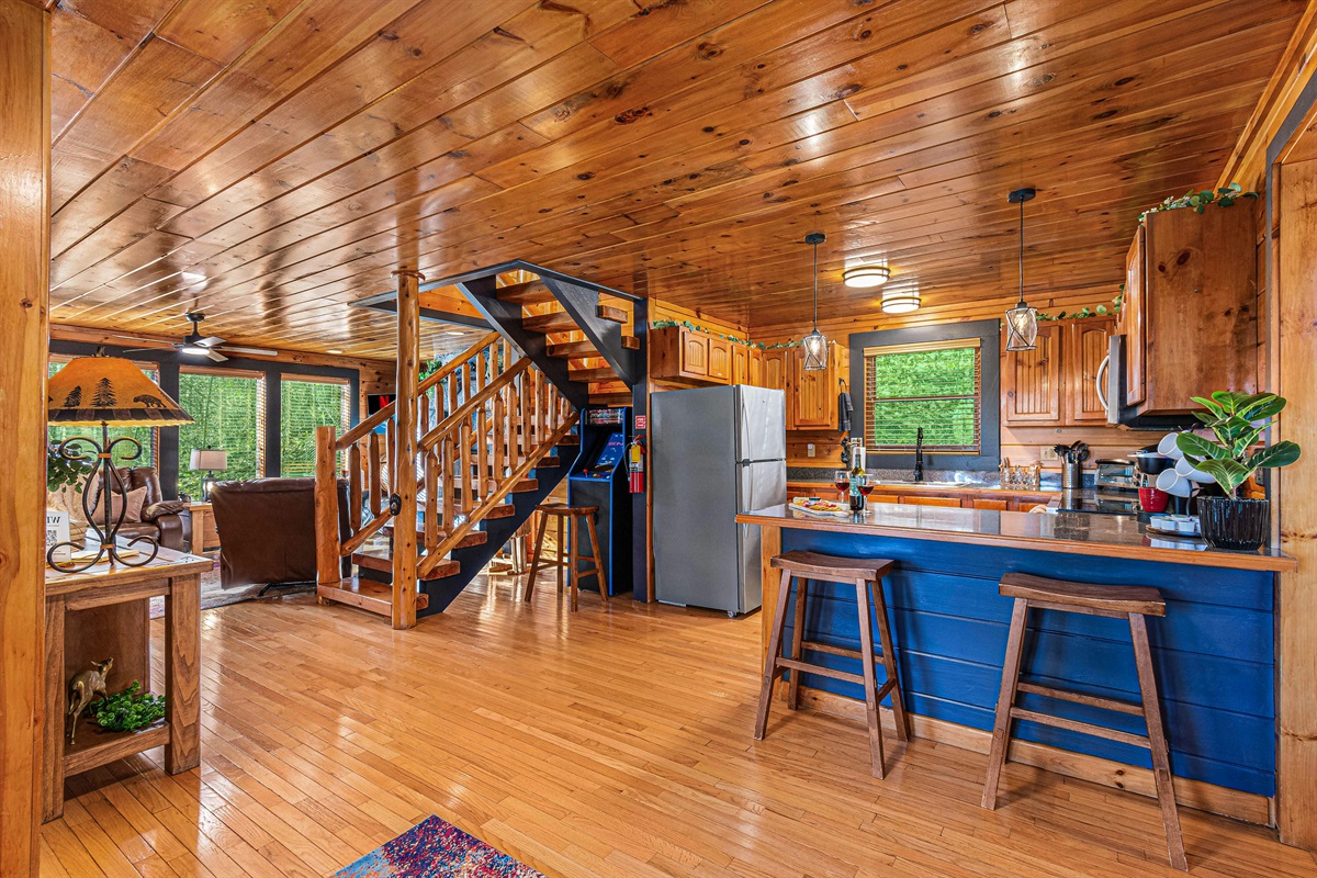 View from the front door of the kitchen, stairs and living room