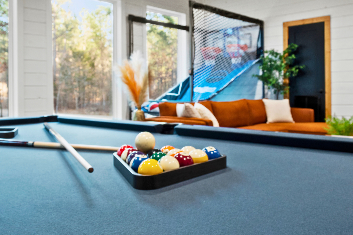 This game room is sure to be a highlight for any guests looking to enjoy some playful competition or simply kick back and unwind.