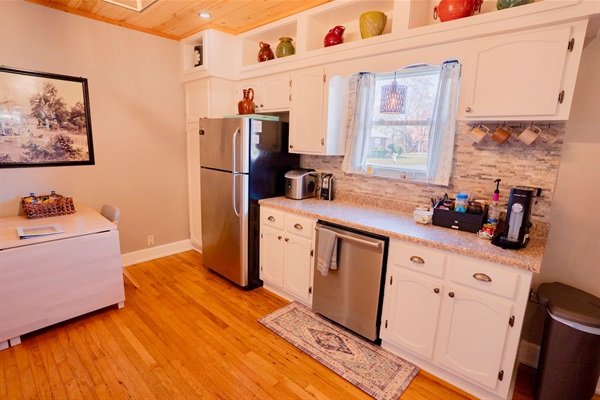 Fully stocked, family-friendly kitchen with modern appliances, plenty of counter space, and everything you need to cook meals or snacks together after a day of exploring Pigeon Forge.