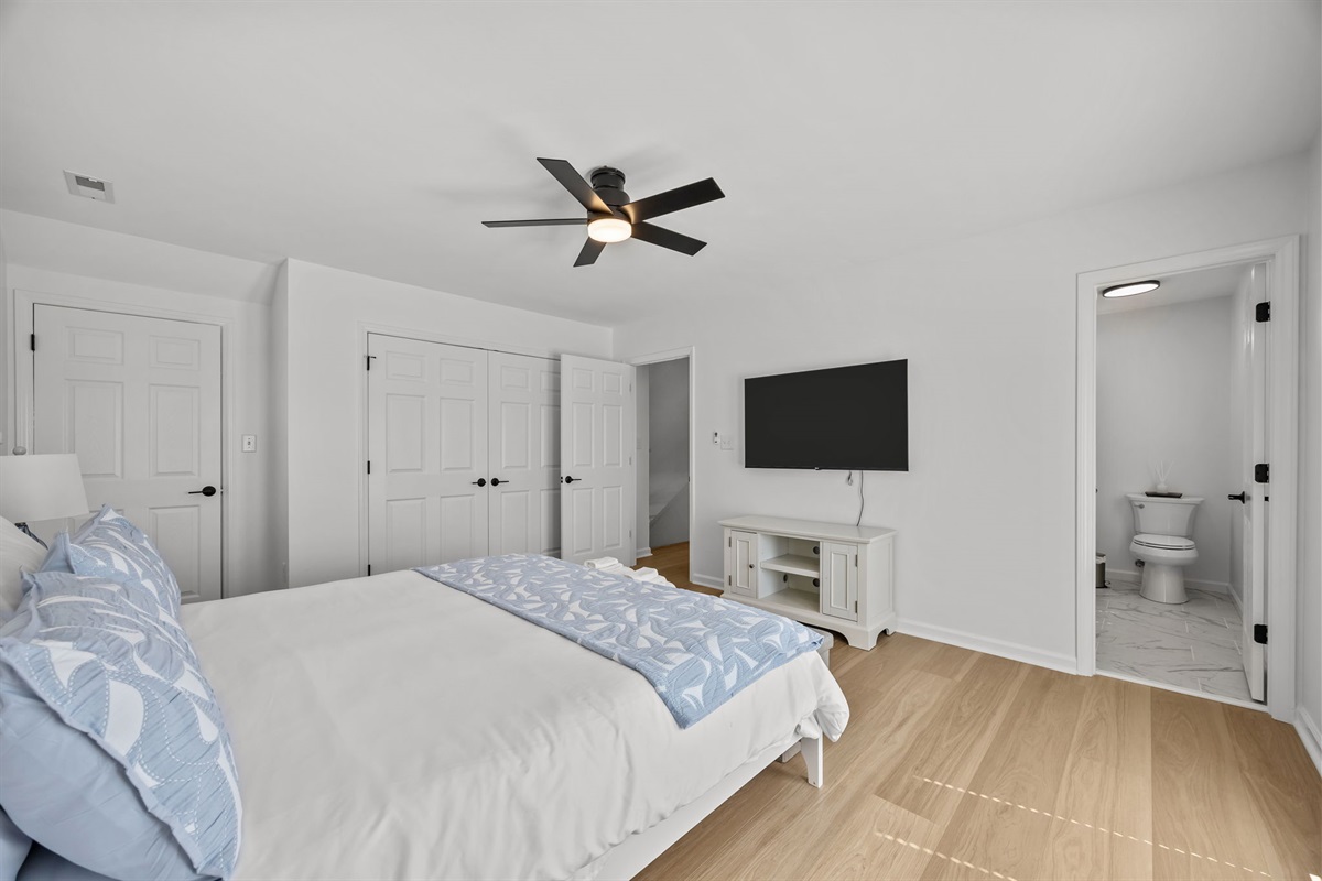 Spacious second floor master bedroom with TV and ensuite bathroom
