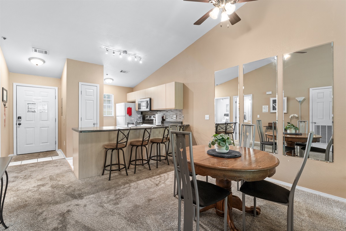 Bar seating and a dedicated dining table make it easy to linger over coffee, takeout, or a game night in.