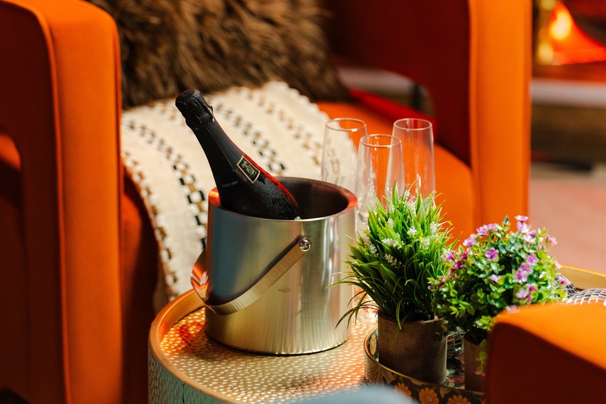 Pop a bottle and kick back in this fun little lounge spot.