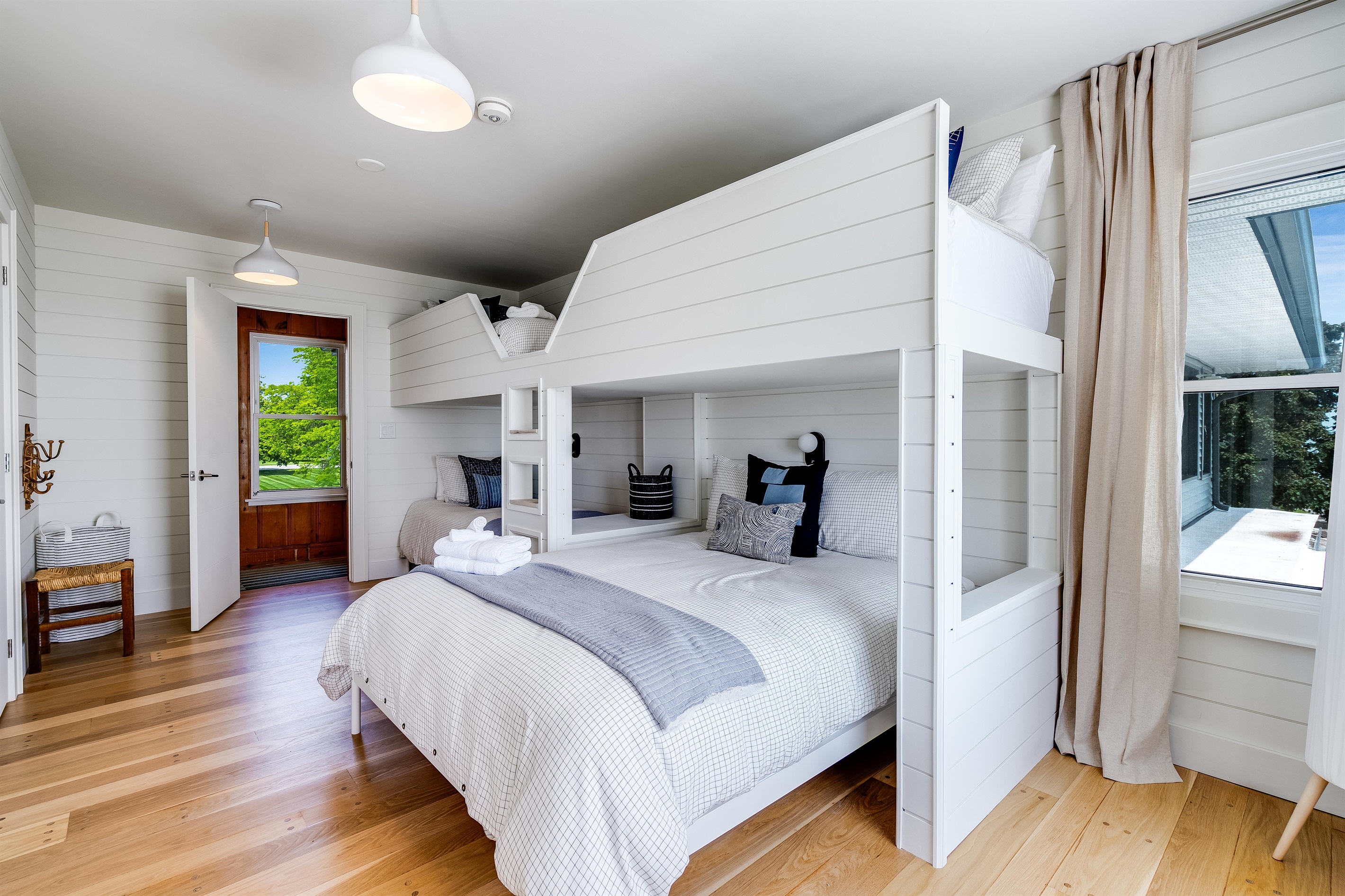 Bedroom with 3 twins, and 1 Queen bed. 