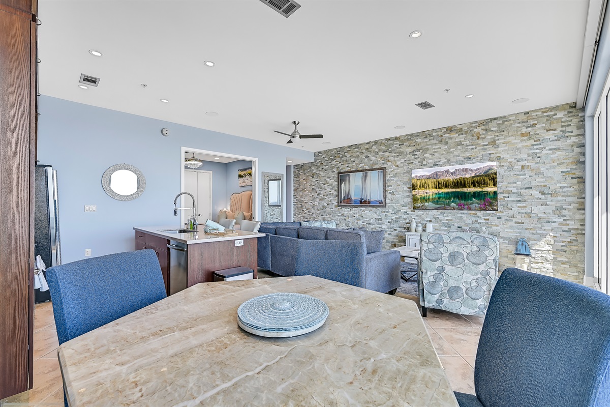 Indoor dining area, recliner, sectional sleeper sofa, kitchen island, 75 inch Samsung smart TV