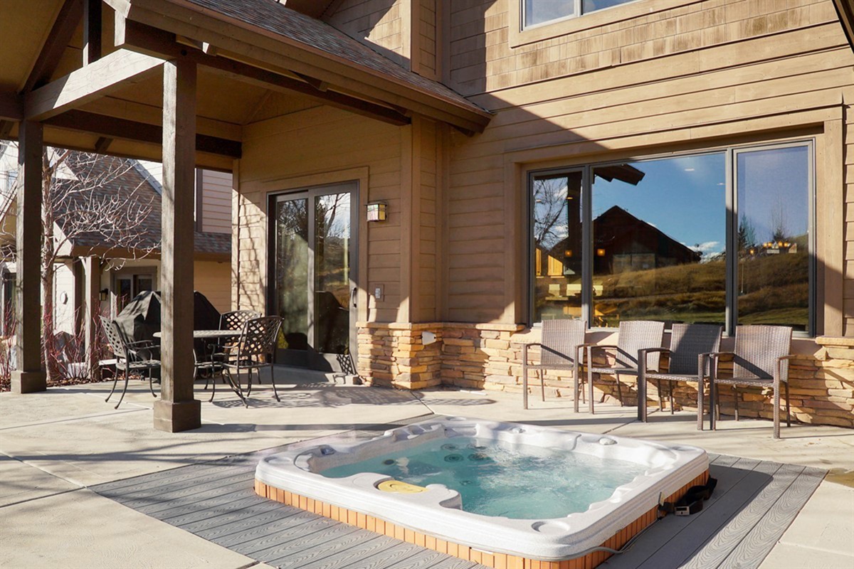 Relax in your private hot tub at the luxurious home.