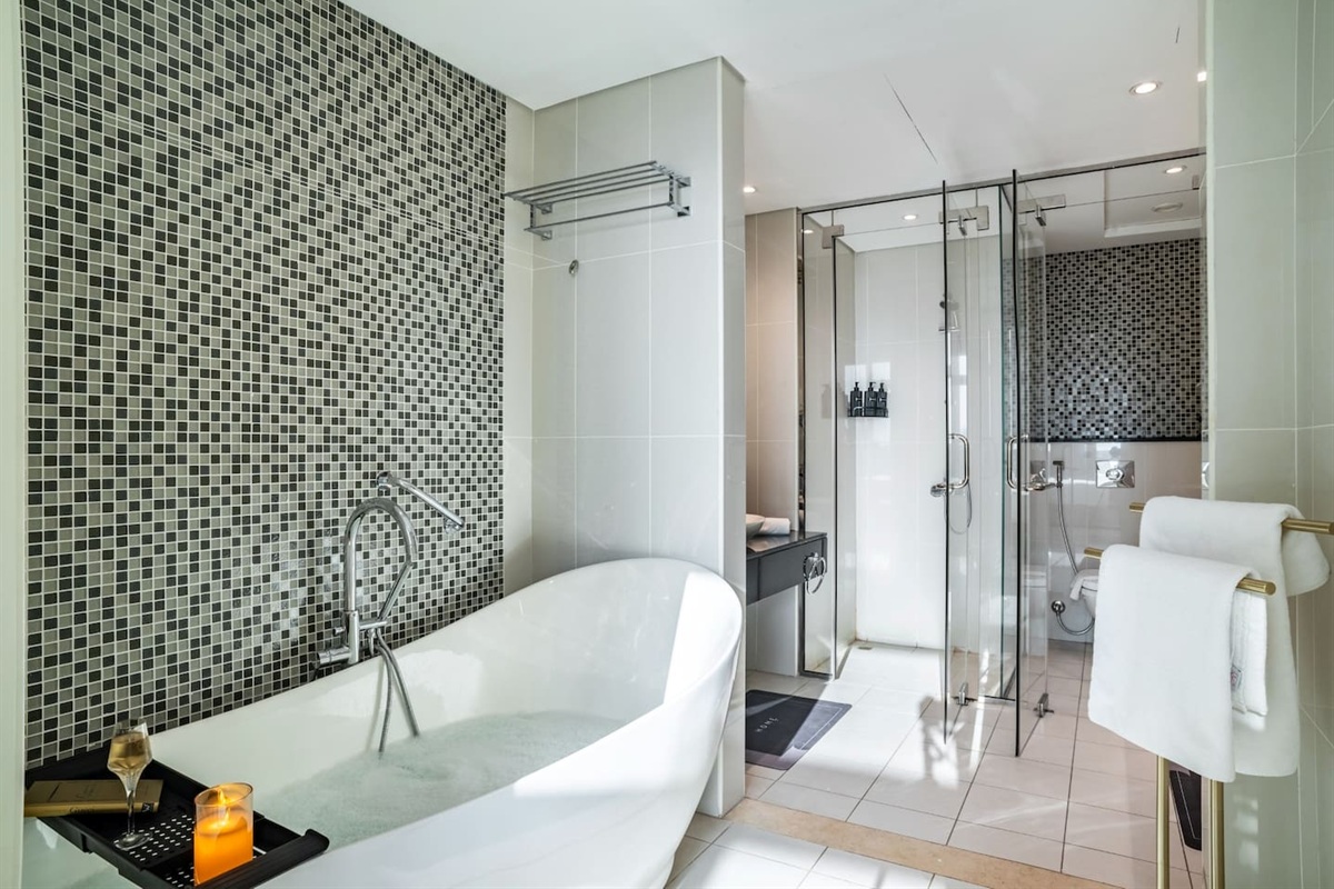 Large bathroom with bath-tube and shower
