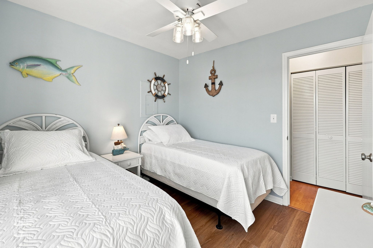 A charming and relaxing guest room decorated with delightful nautical accents and ample closet space.