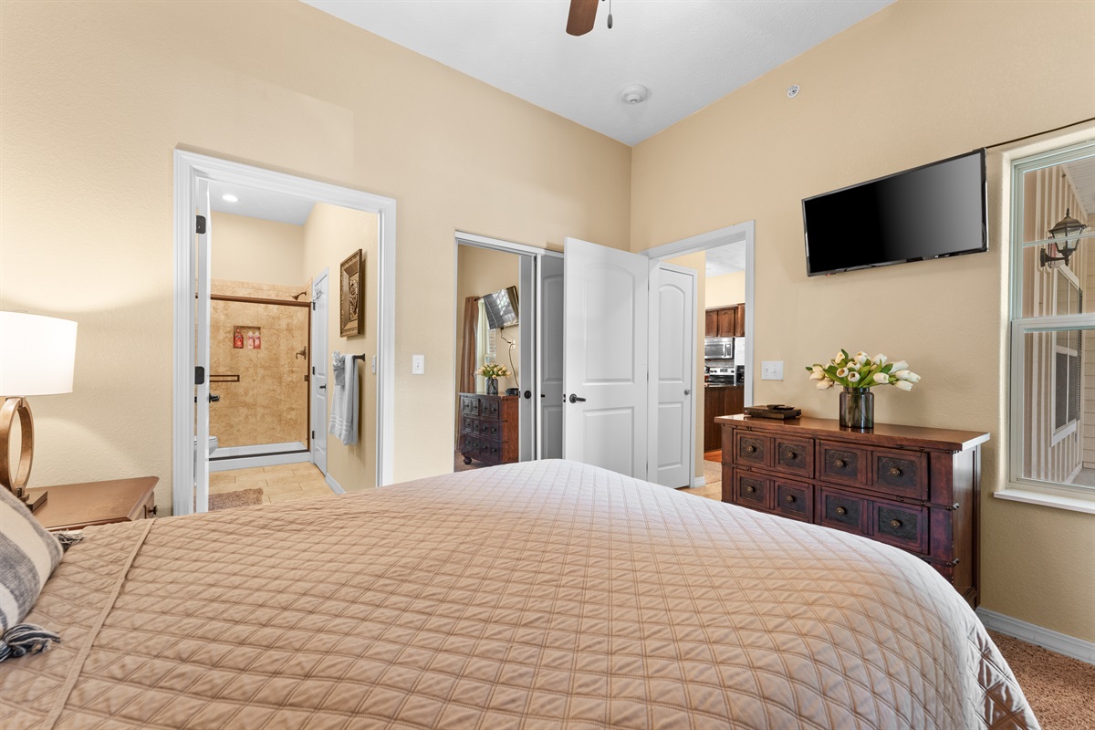 Another look at the queen suite, with easy access to its private bath and plenty of room for luggage.