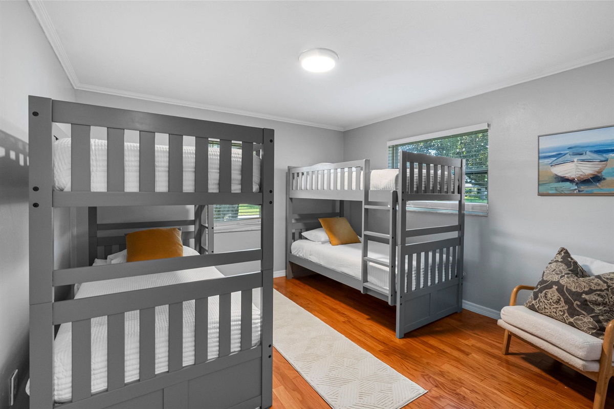 Designed with families in mind, this playful room offers cozy sleeping arrangements for up to four guests.