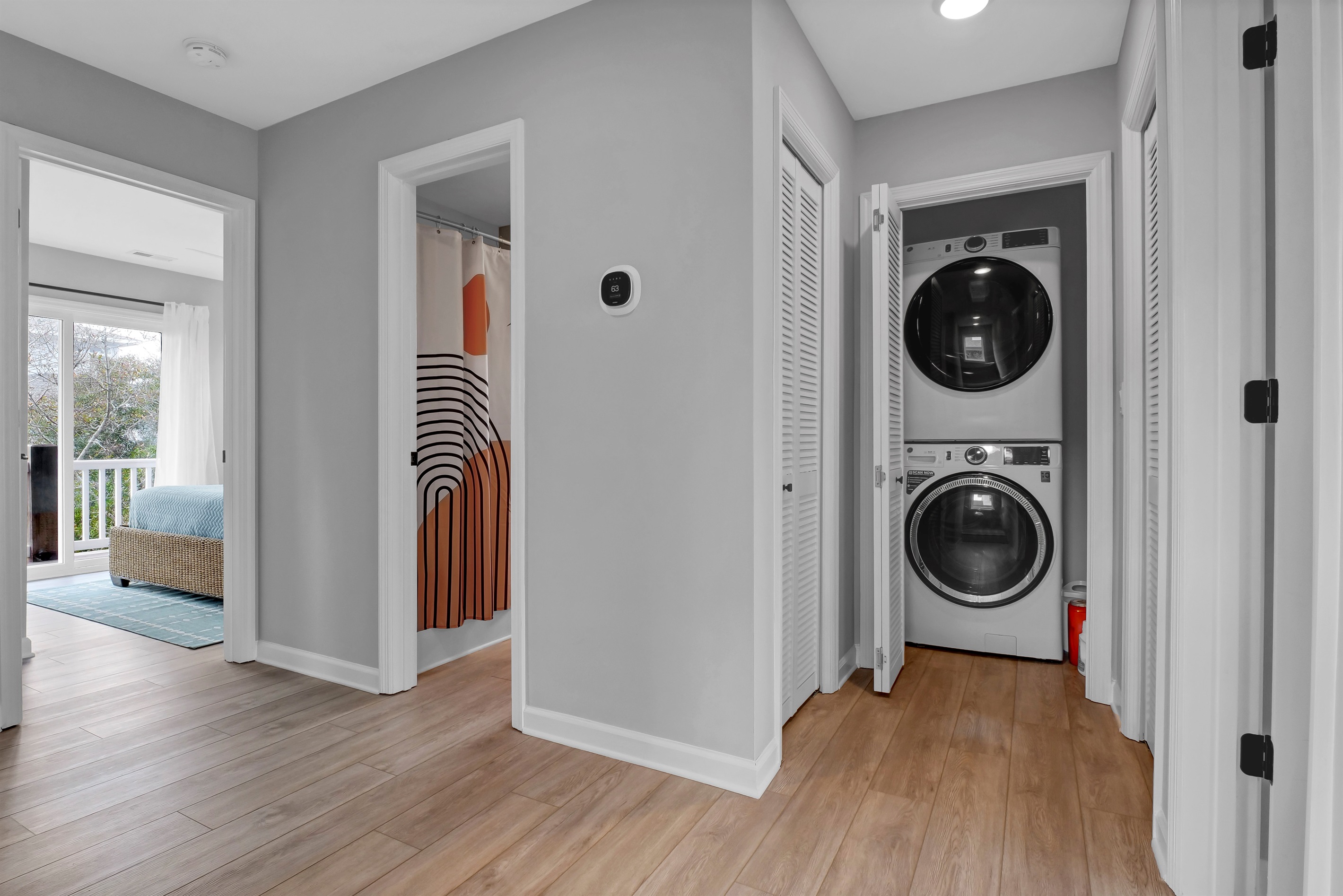 Full hall bath and laundry combo designed to make group stays seamless and comfortable.