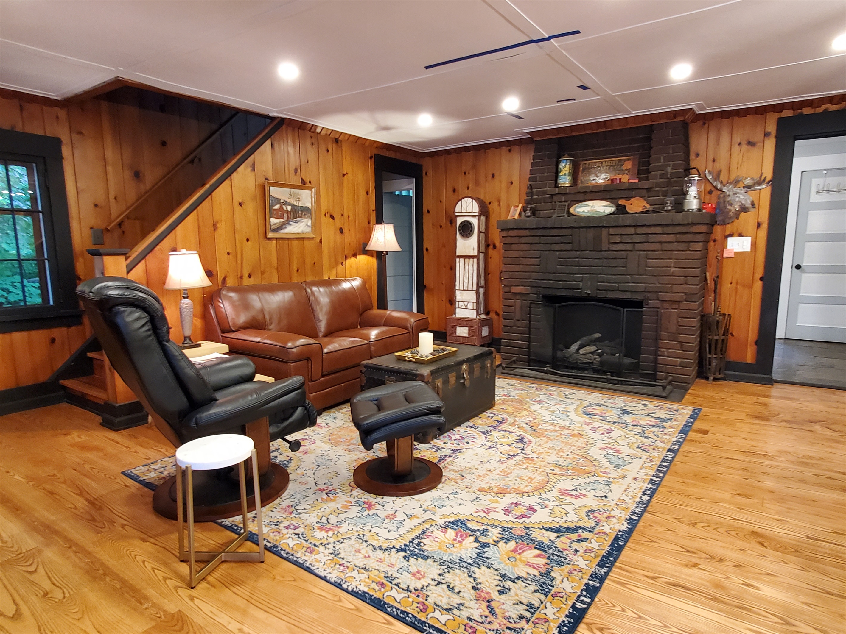 Lounging area with original fireplace.