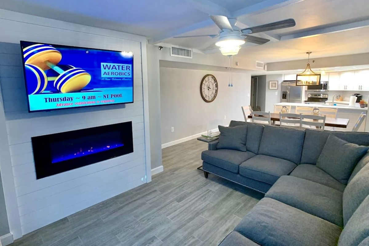 Fireplace in living room with smart Tv. Open floor plan 