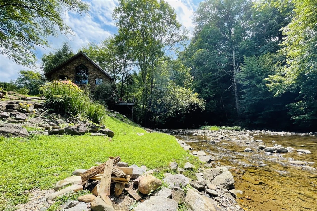 The house looks down on beautiful Spring Creek, has a firepit, and an excellent swimming and fishing hole