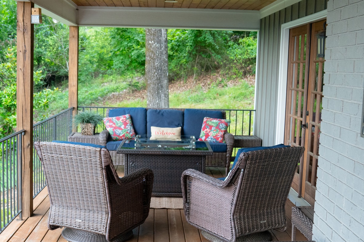 Relax on the cozy couch and rocking chairs for a peaceful retreat.