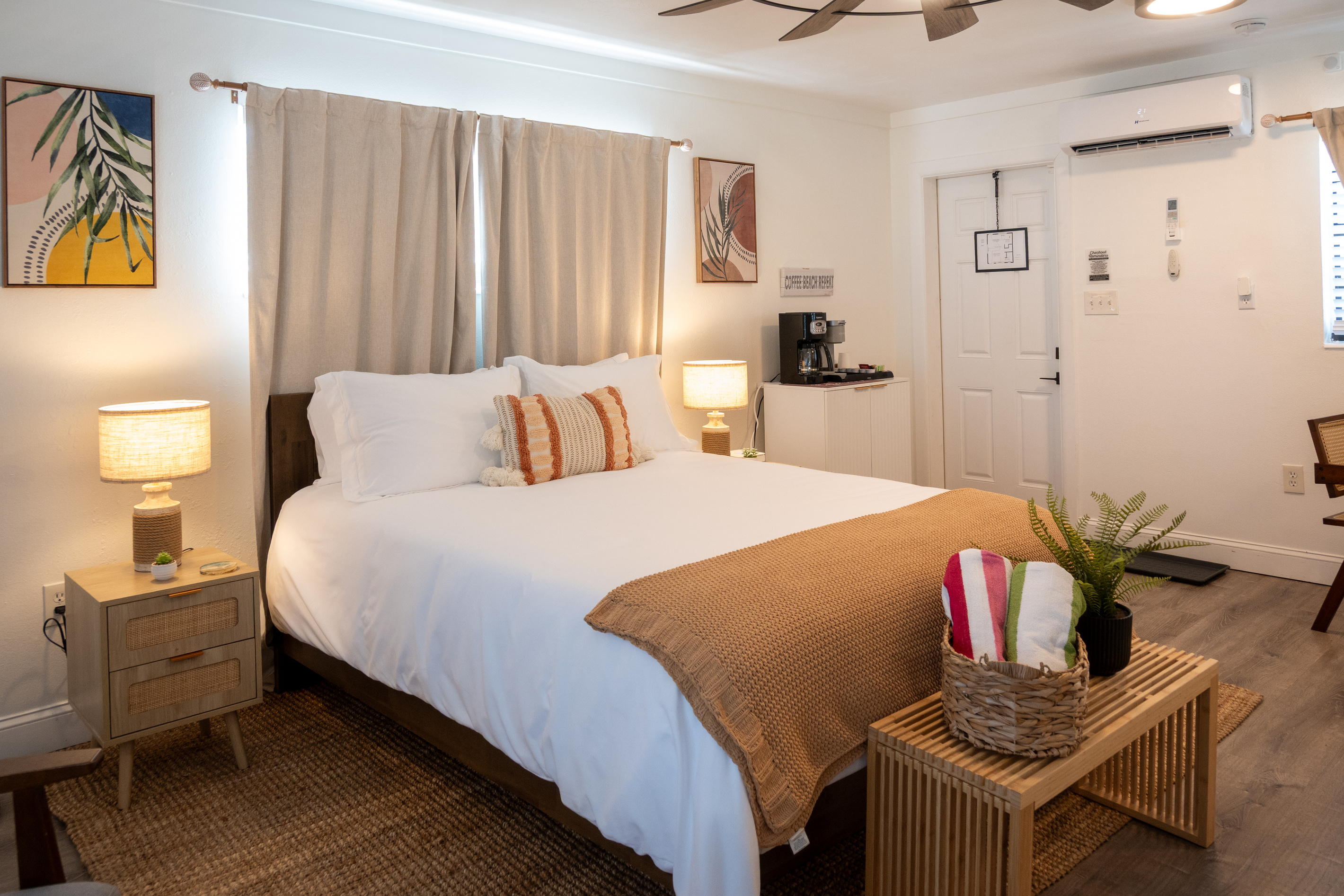 Crisp hotel-quality linens, warm boho textures and bedside lamps