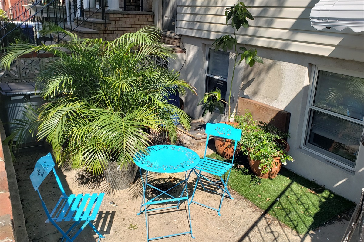 Step outside to this charming patio where café style seating and greenery invite you to linger in the fresh air.