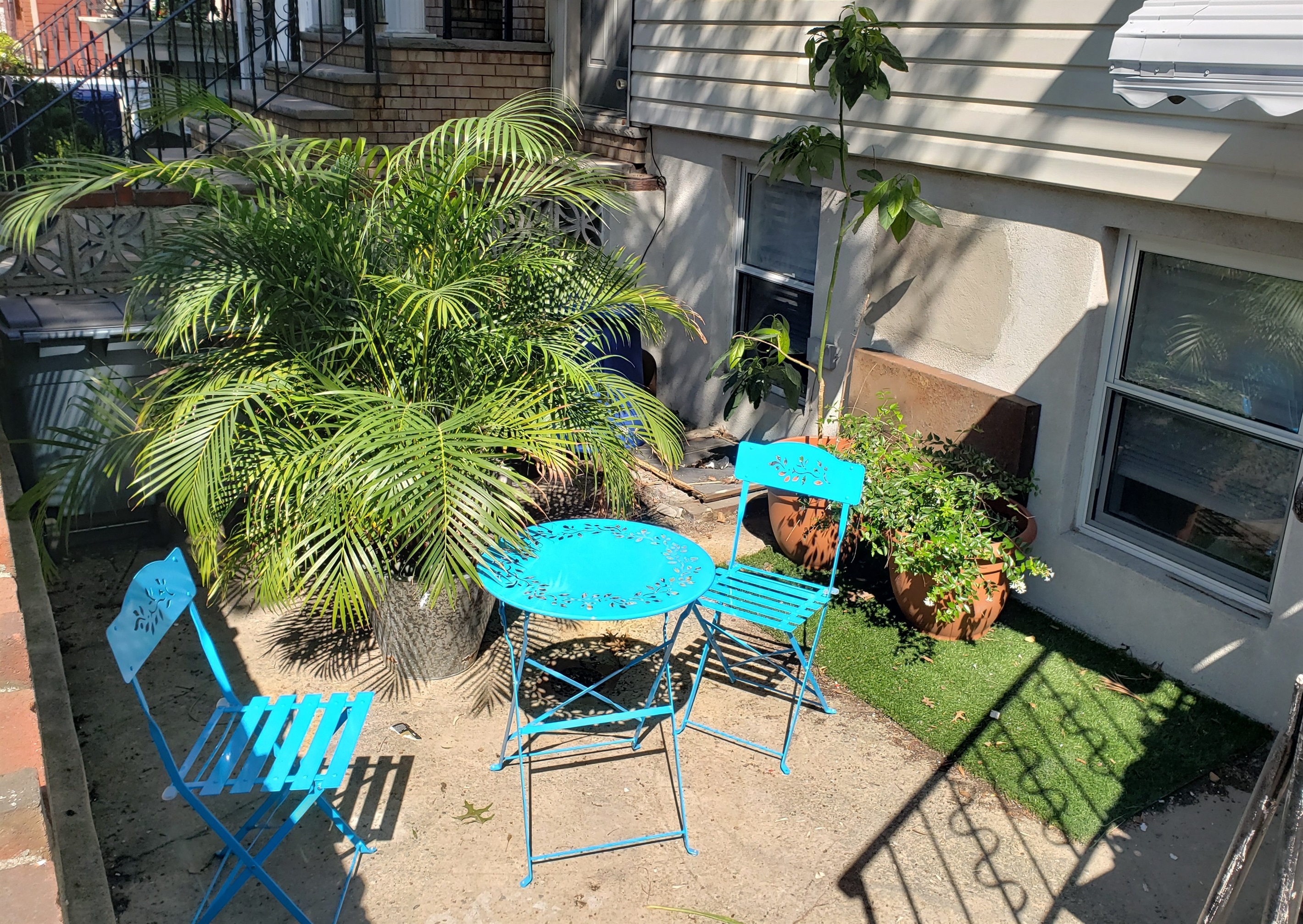 Step outside to this charming patio where café style seating and greenery invite you to linger in the fresh air.