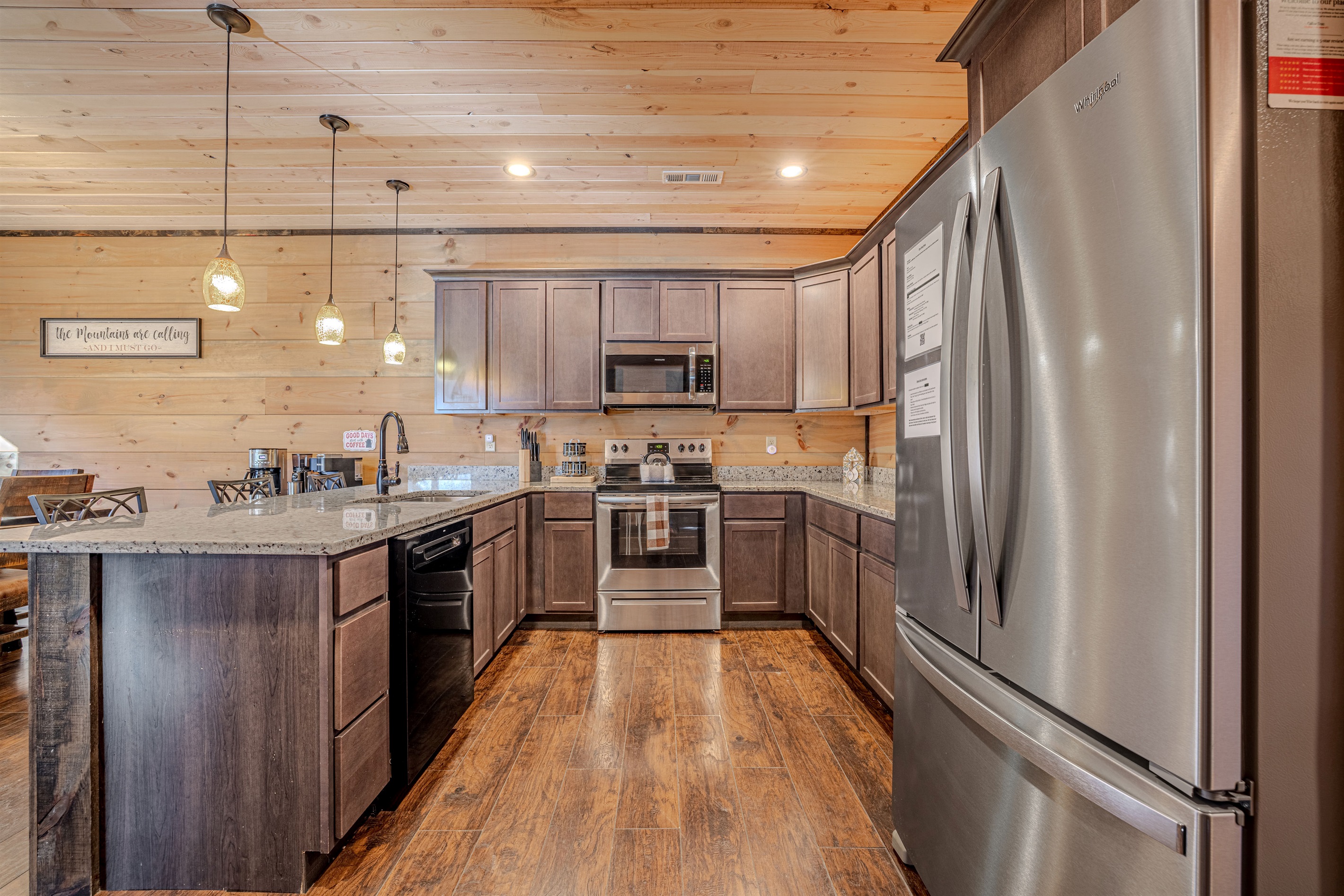 Spacious kitchen with island seating and modern appliances.