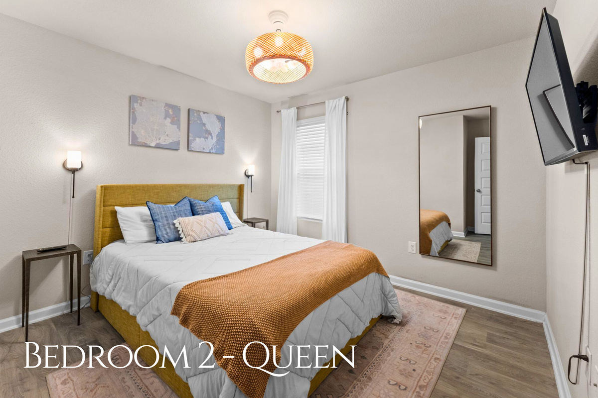 The second bedroom features a cozy queen bed and a calm, comfortable atmosphere that&rsquo;s perfect for a good night&rsquo;s rest.