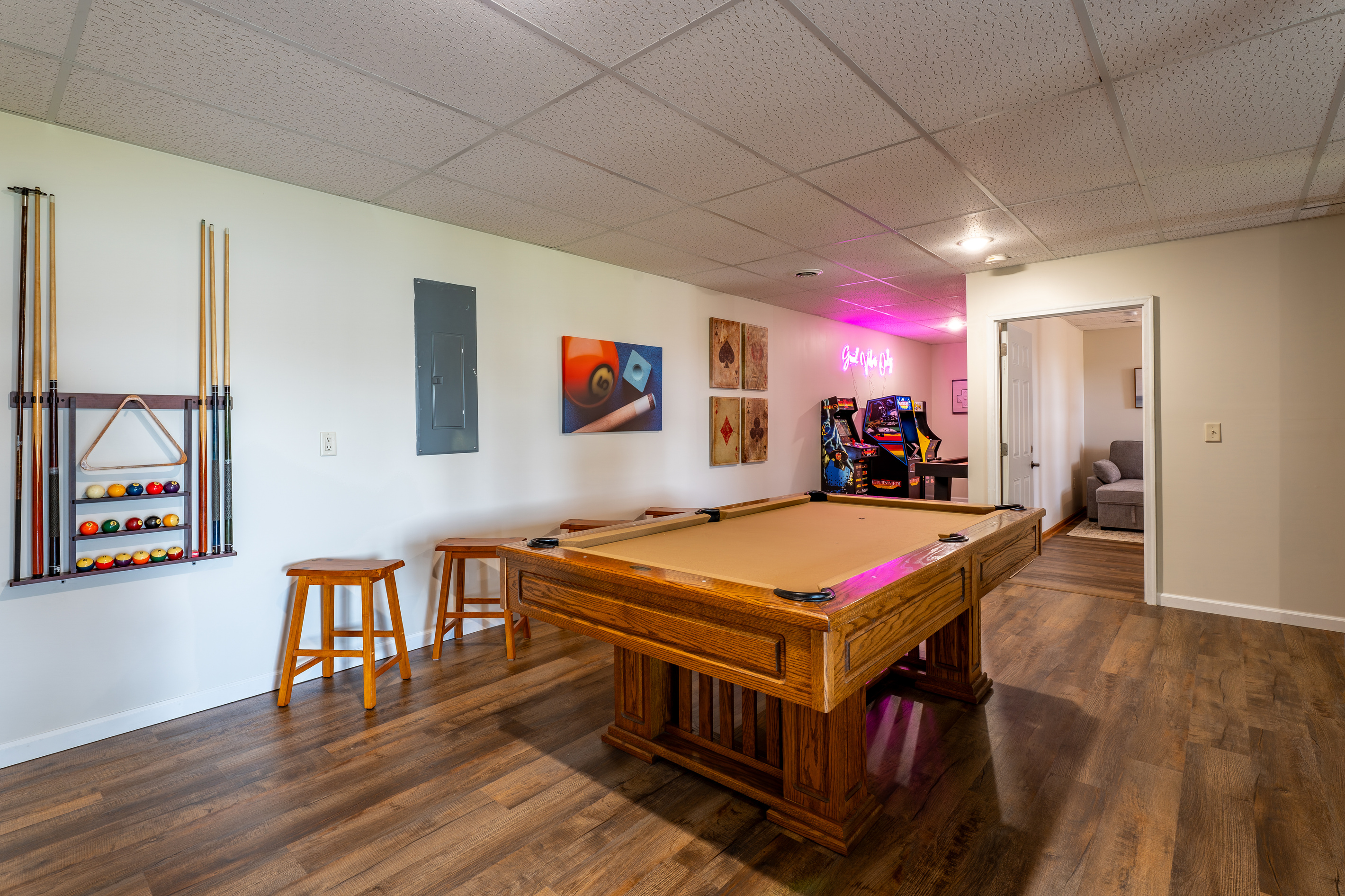 Professional Olhausen slate pool table, bar stools, and the kind of game room that keeps the group up way too late