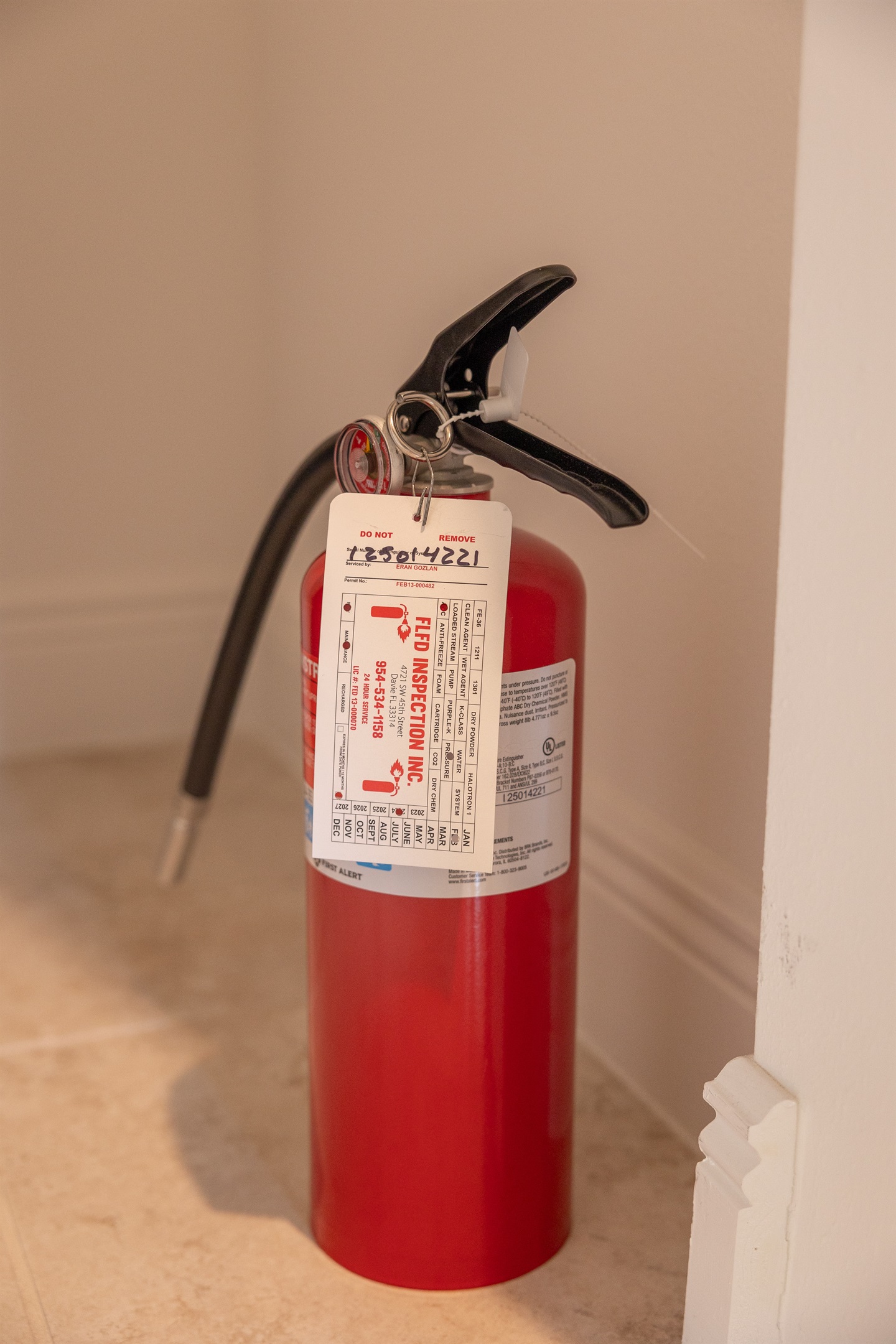 Fire extinguisher located under kitchen sink.