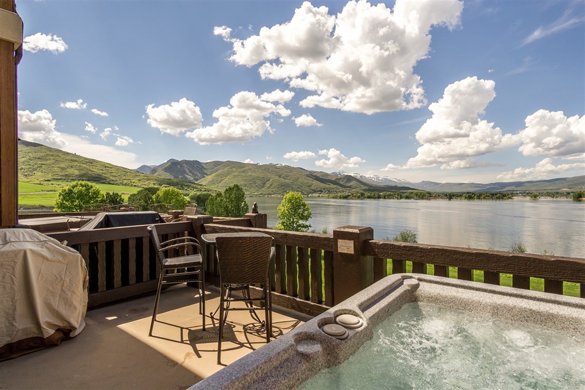 Soak in your private hot tub while overlooking Pineview Reservoir and sweeping mountain vistas—an unforgettable outdoor retreat where relaxation meets breathtaking scenery.
