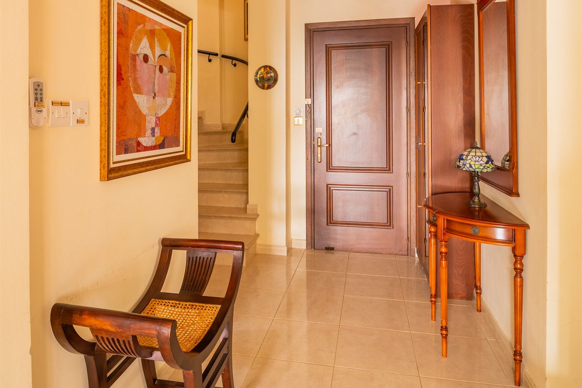 Staircase to the second floor where you find the three bedrooms and the balcony.