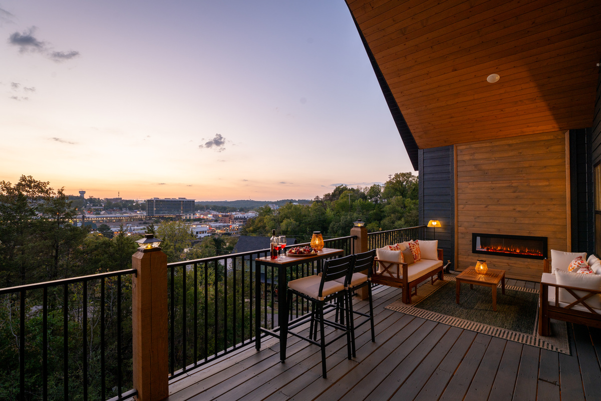 As the sun goes down, the deck becomes one of the best seats in the house—complete with an outdoor fireplace and views over Branson.