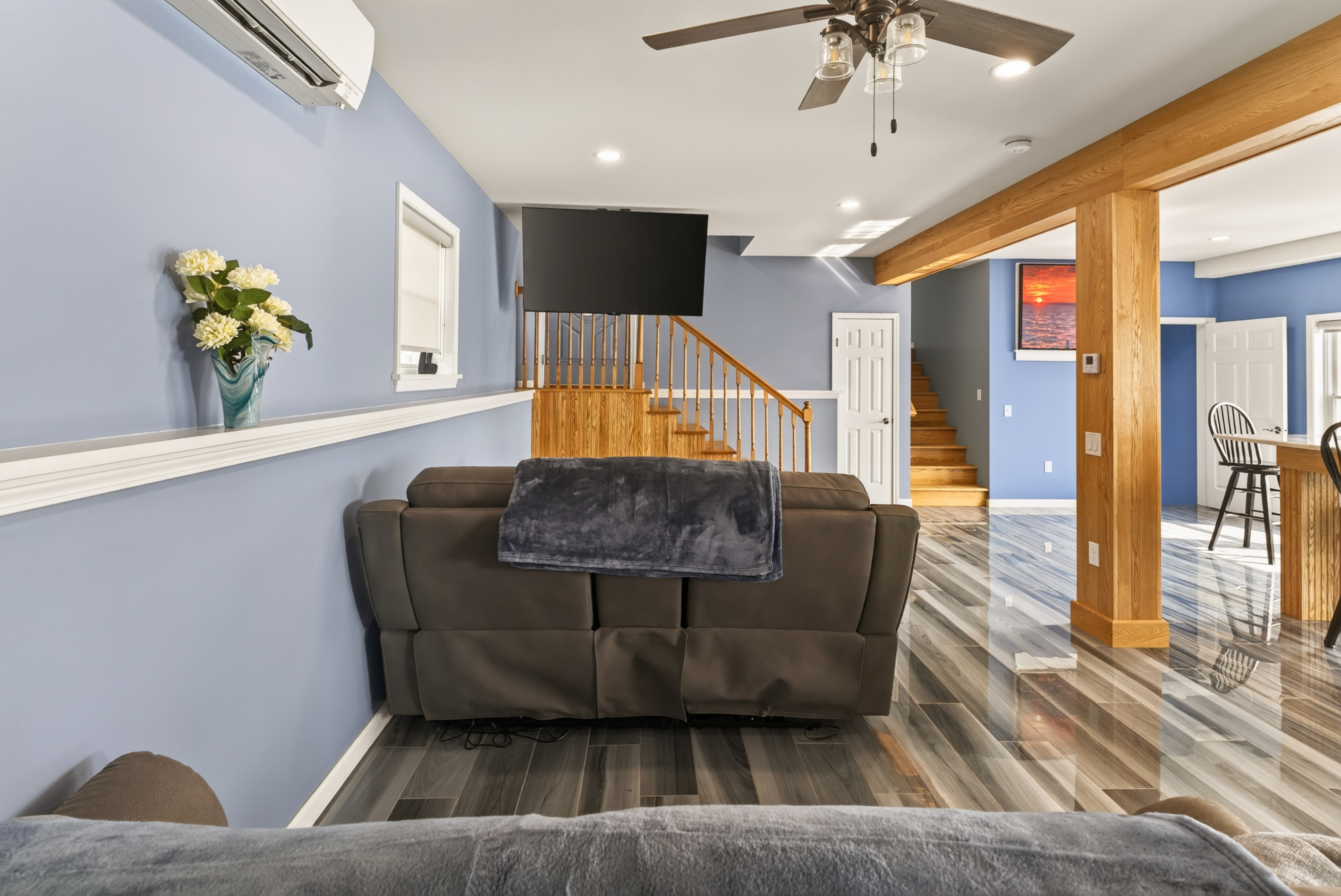 Living room with sectional and mounted television