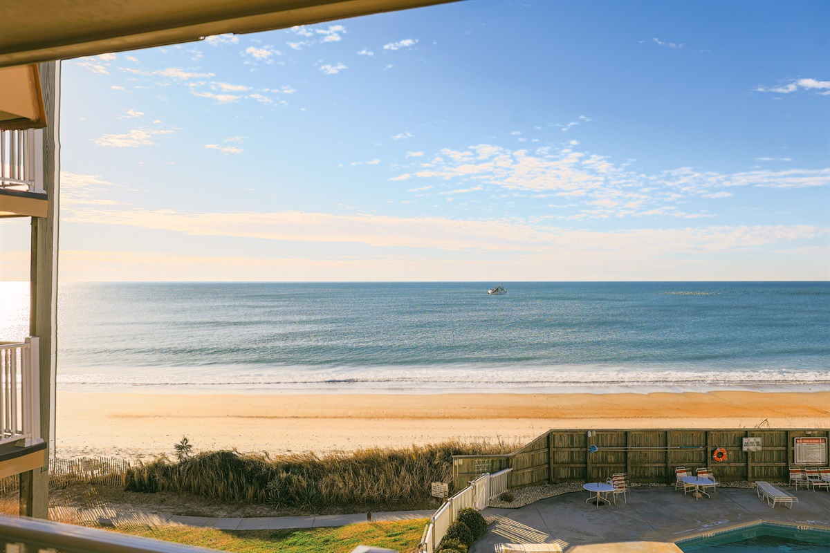 From the balcony, the ocean stretches infinitely