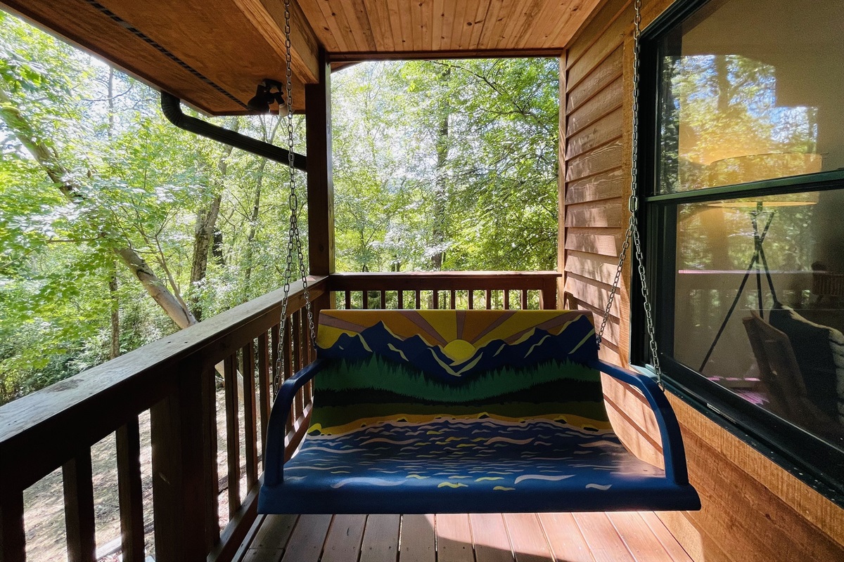 Hand painted front porch swing is a divine place to spend time