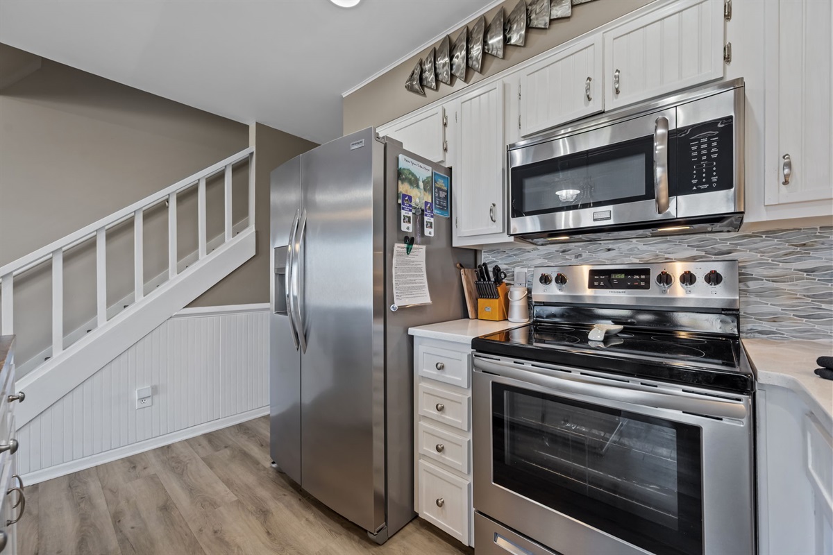 Fully equipped kitchen with stainless steel appliances and everything you need to cook meals during your stay