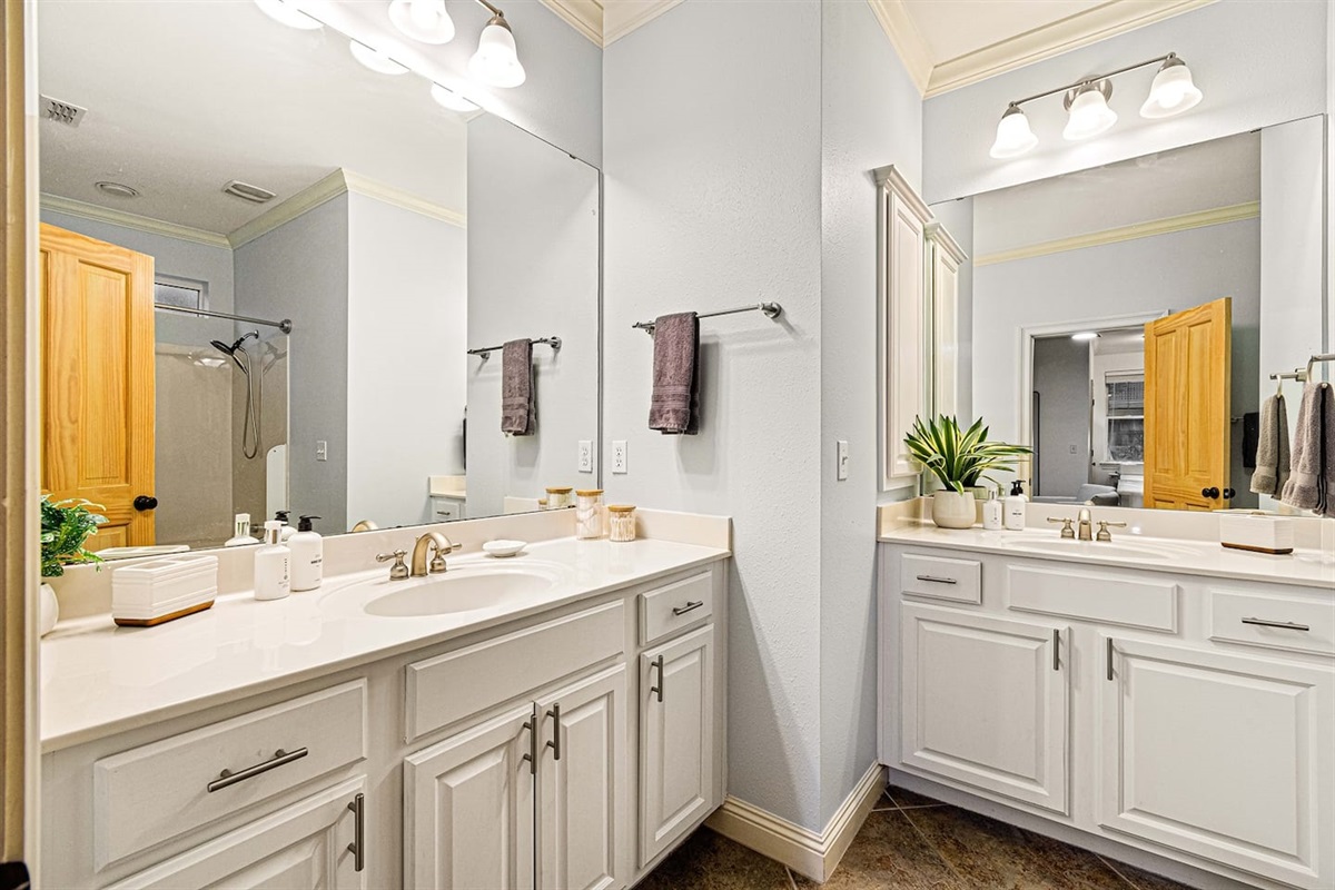 No morning jostling. The ensuite master bath has two separate vanities so you can both get ready at once.