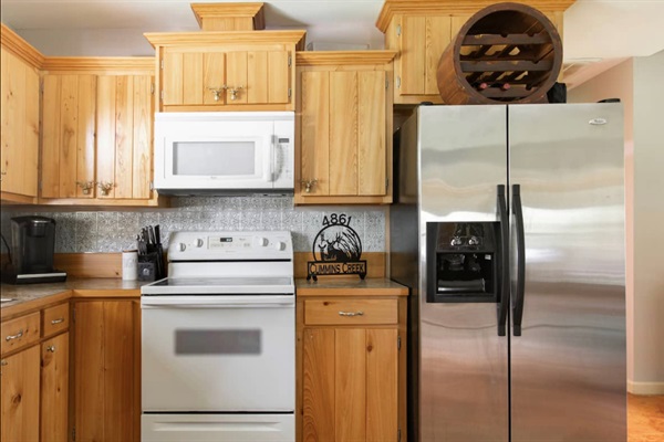 Full size fridge and even a deep freeze. Town and Grocery Stores are just a 20 minute away (or a stop on your way in)