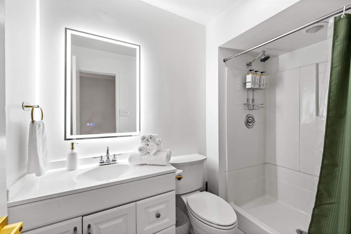 Bright, spacious bathroom with luxury finishes and large vanity.