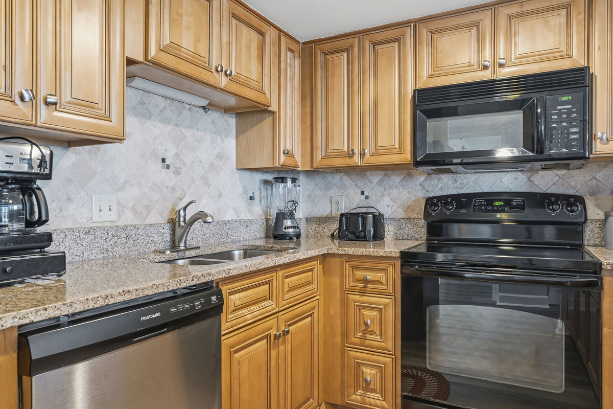 Kitchen counter with coffee maker, blender and toaster