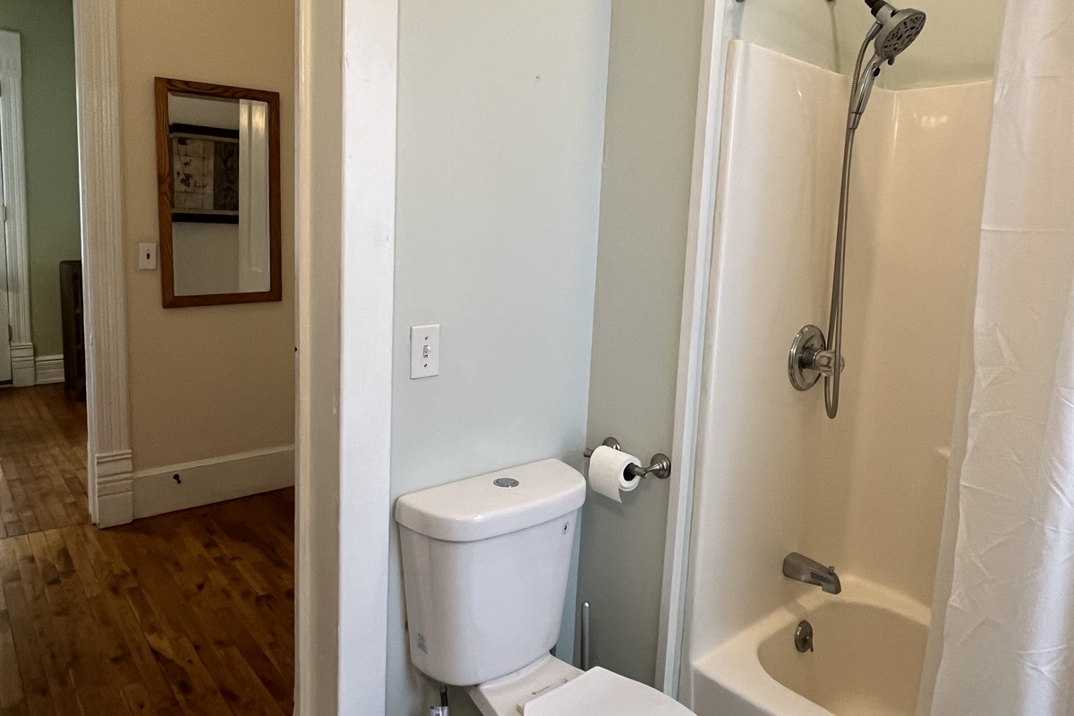 Bathroom with tub/shower, steps from each bedroom