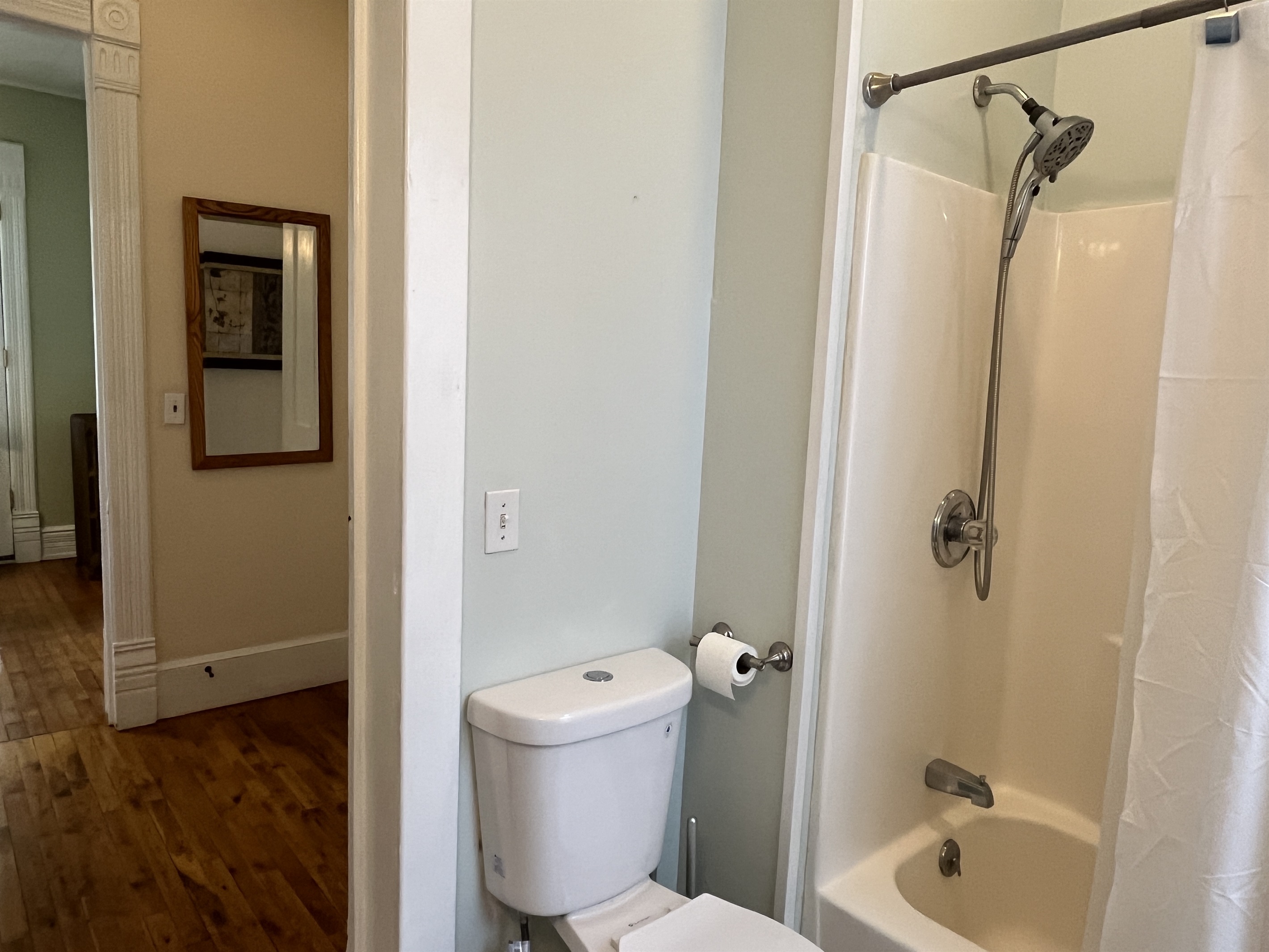 Bathroom with tub/shower, steps from each bedroom
