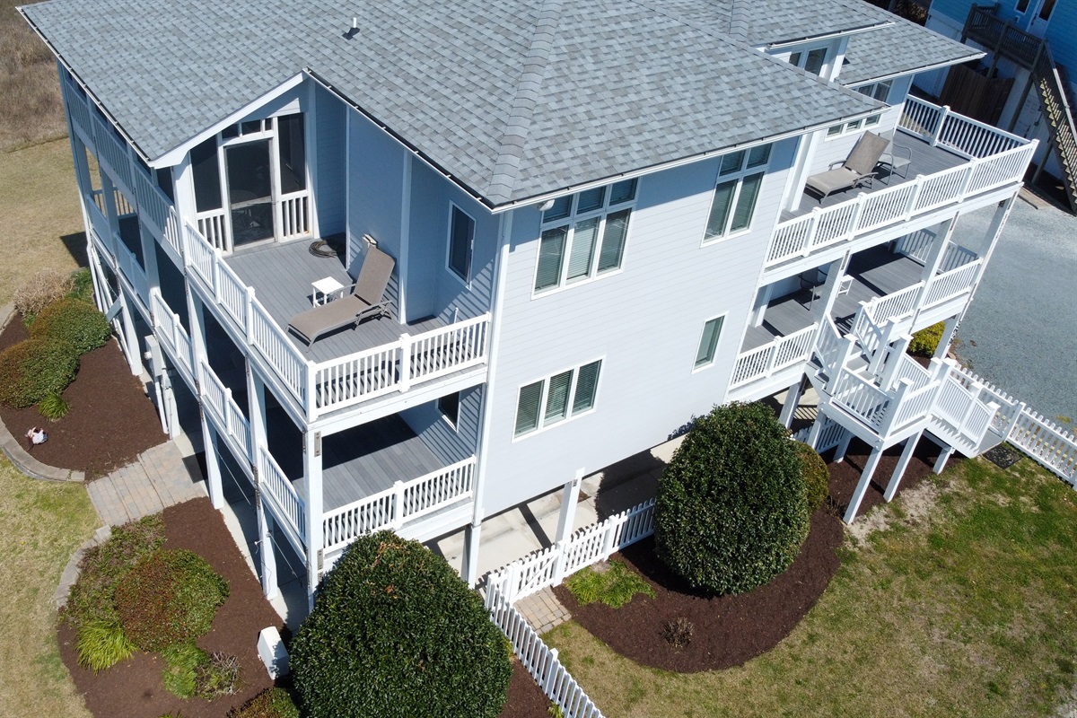 Multiple levels of covered and open decking with sound views