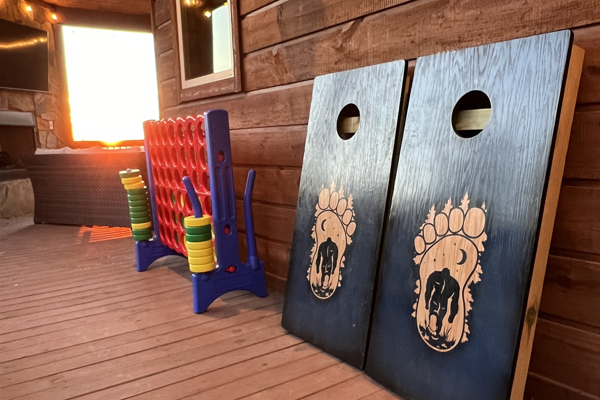 Cornhole and Giant Connect 4 games on lower deck.